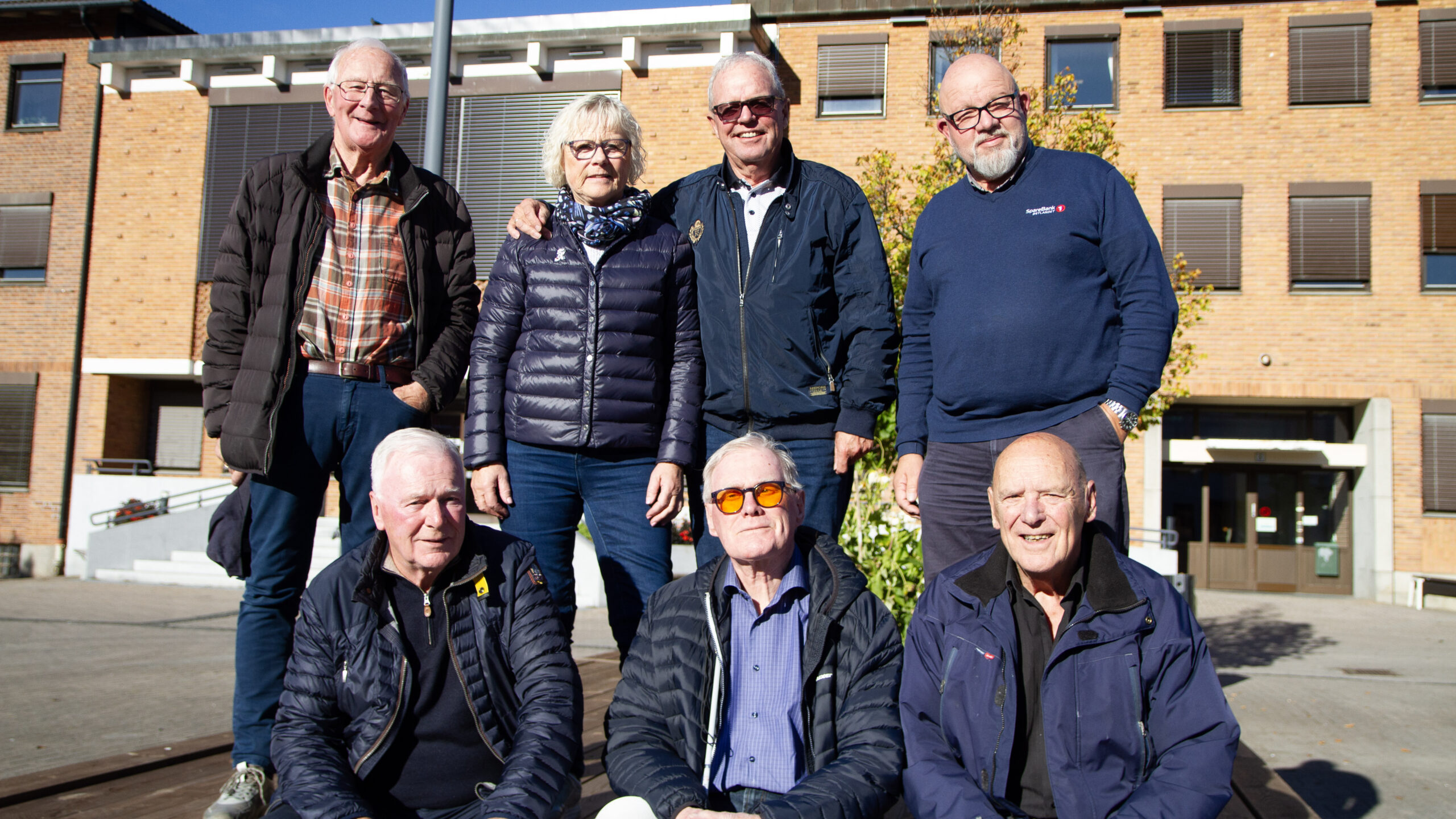 Blide korpsmusikere i september 2025. Bakfra: Leif Erling Arnesen, May og Erik Strand og Øystein Bjørkli. Foran Knut og Jan Pedersen, samt Jan Arne Svendsen.